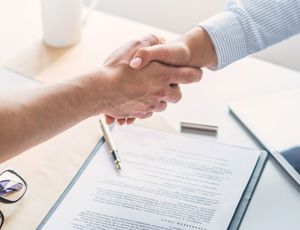 A handshake happening in a meeting
