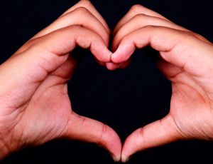 hands formed in a heart shape