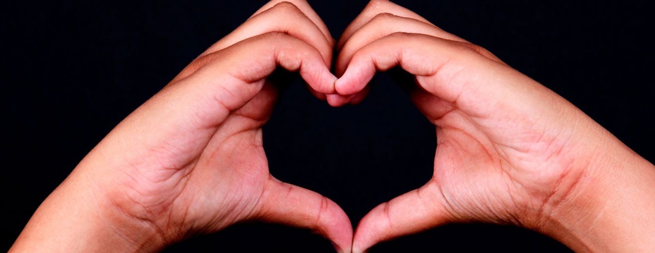 hands formed in a heart shape