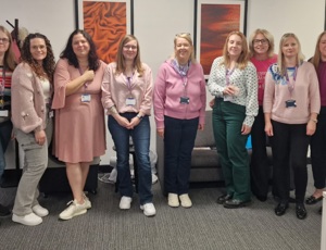 Procurement services team wearing pink supporting breast cancer