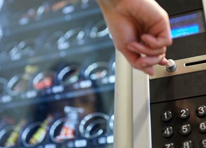 A person using a vending machine