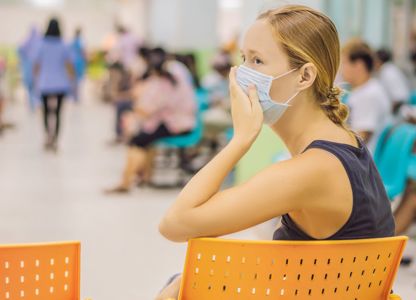 A patient waiting in a hospital waiting area