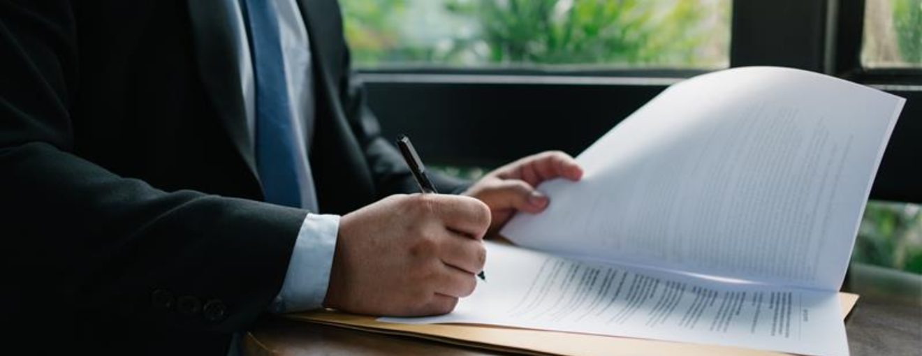 A person signing a contract