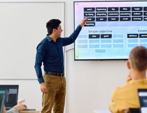 Teaching delivering a lesson to students