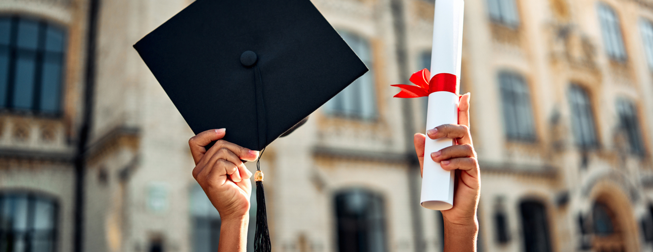 A graduation cap and scroll