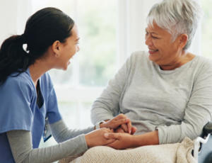 A health care worker supporting a patient