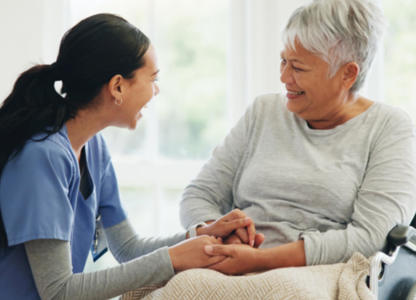 A health care worker supporting a patient