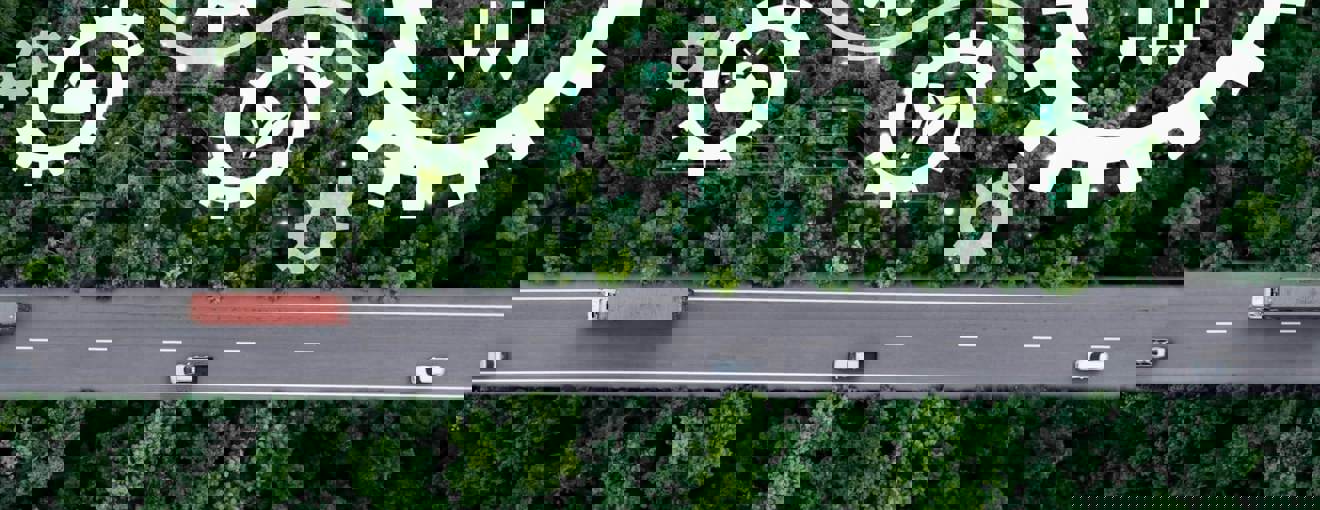 Road through a remote landscape with a technology graphic overlay