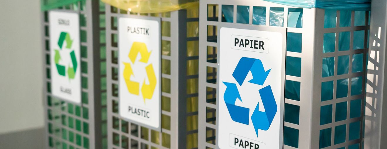 Three rubbish bins in a row